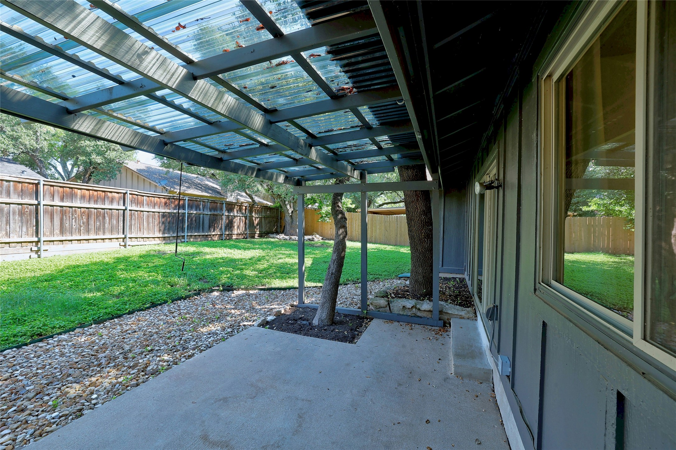 11720 Running Fox Trail Austin, TX 78759 - Photo 26 of 31 a view of a porch with furniture and garden