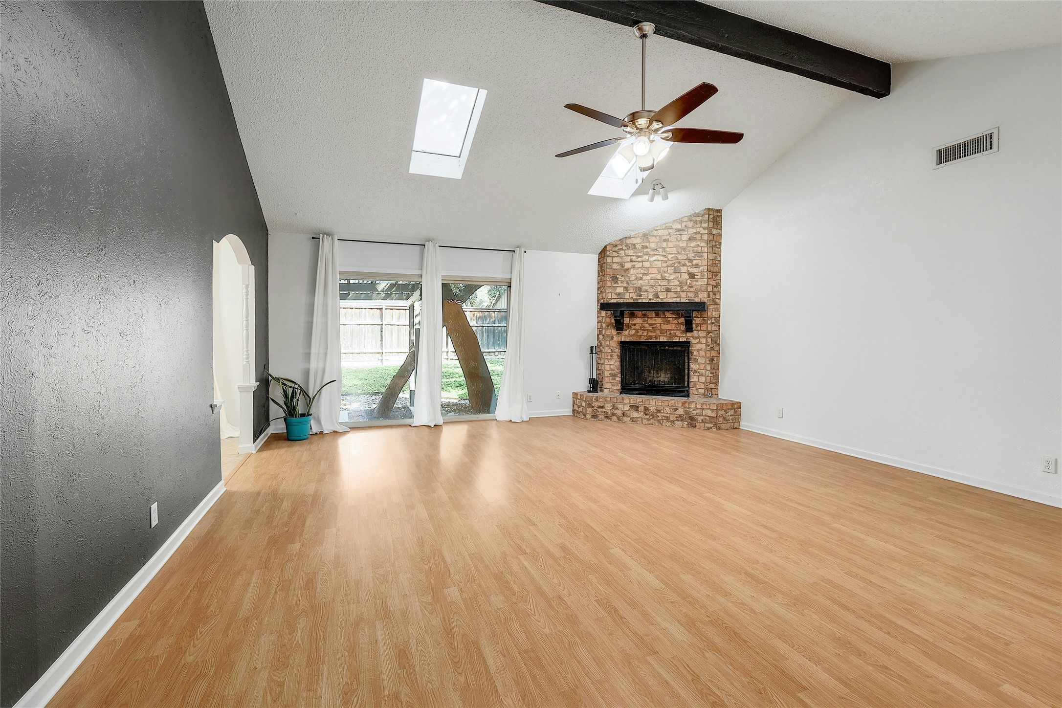 11720 Running Fox Trail Austin, TX 78759 - Photo 3 of 31 a view of empty room with wooden floor and fan