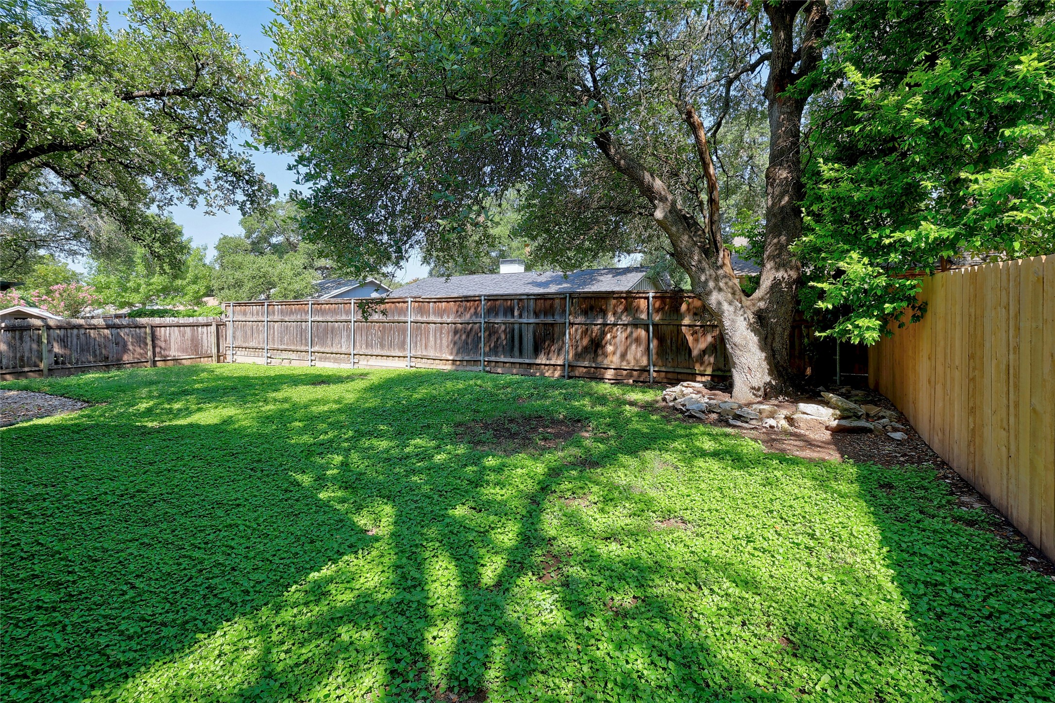 11720 Running Fox Trail Austin, TX 78759 - Photo 31 of 31 a view of a house with a backyard and a patio