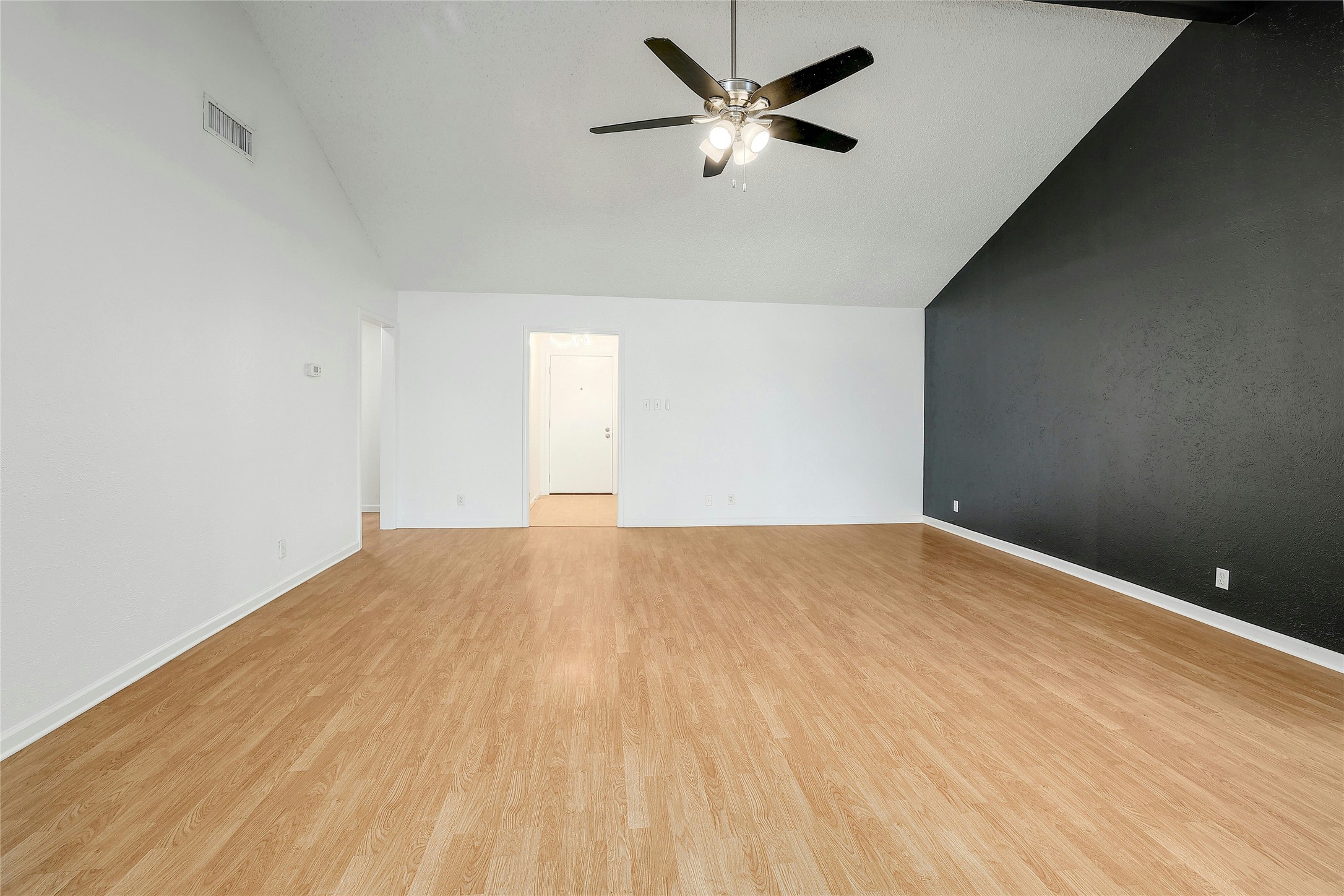 11720 Running Fox Trail Austin, TX 78759 - Photo 6 of 31 a view of empty room with wooden floor