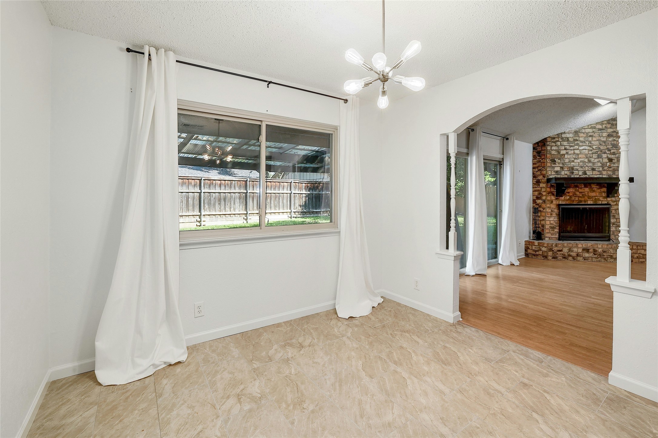 11720 Running Fox Trail Austin, TX 78759 - Photo 9 of 31 a view of a livingroom with wooden floor and a ceiling fan