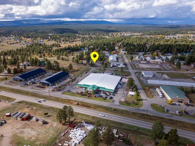 a view of a parking area covered with trees