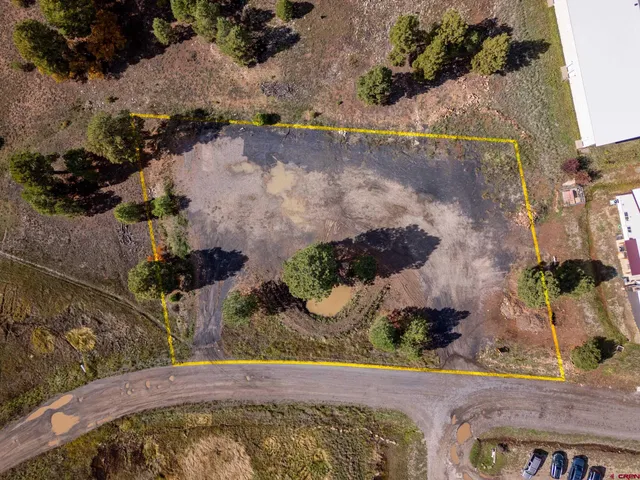 a view of multiple houses with a yard