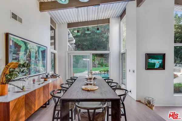 a view of a dining room with furniture window and outside view