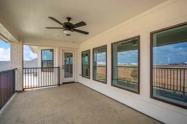 a view of a big room with a big yard and potted plants
