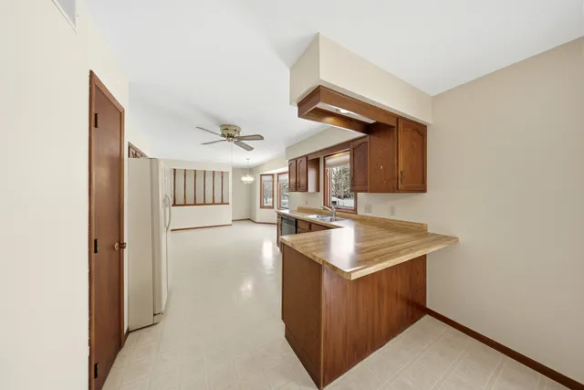 a kitchen with a stove a sink and a refrigerator