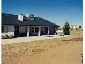 9397 East Mountain Vw Road Prescott Valley, AZ 86315 - Photo 7 of 12 a front view of a house with a yard