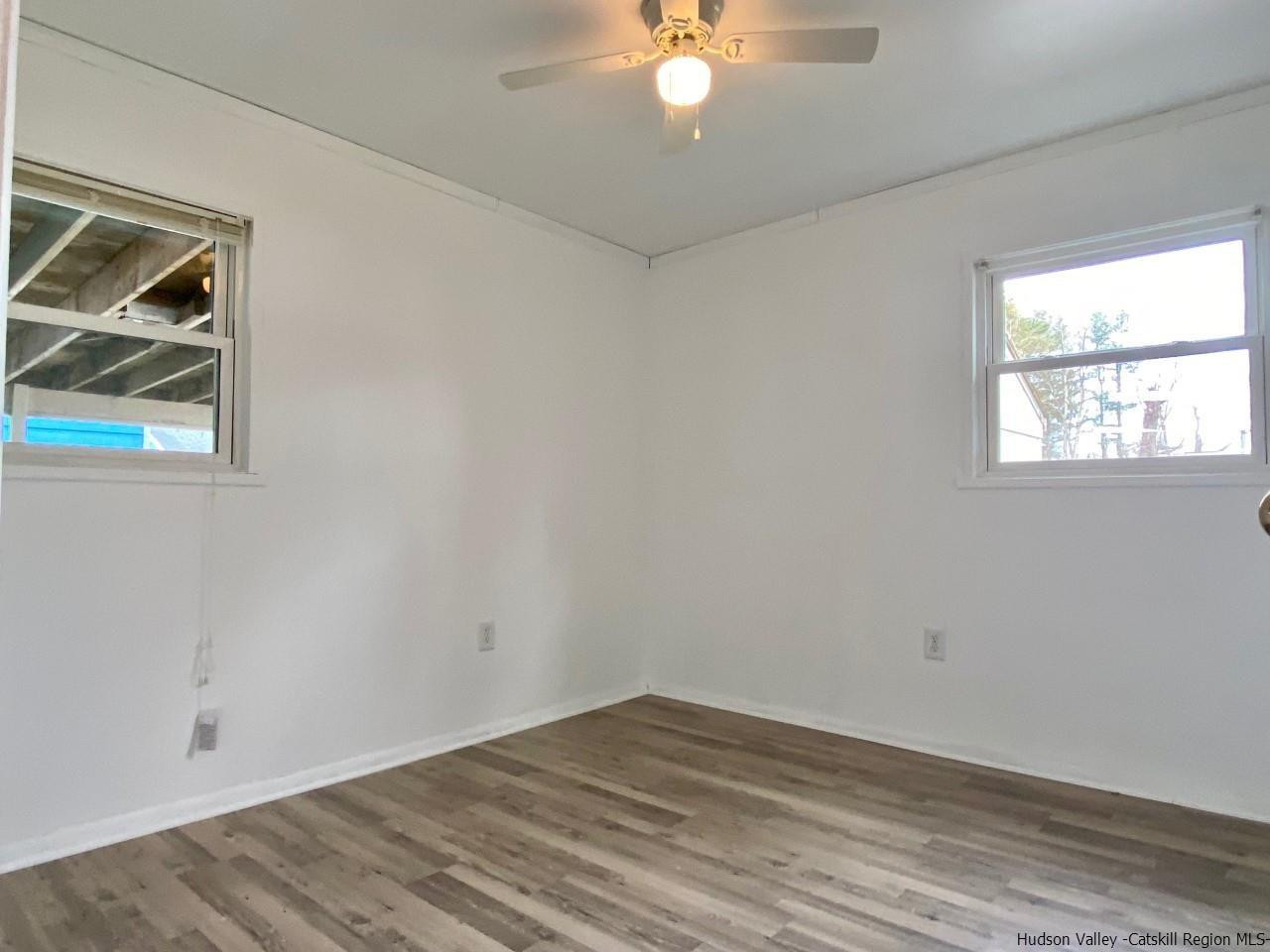 5 South Road, Unit HIGH FALLS PARK High Falls, NY 12440 - Photo 7 of 14 wooden floor in an empty room with a window