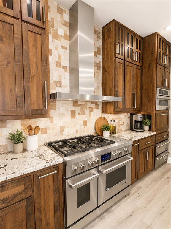 6004 Ridgemore Drive Parker, TX 75002 - Photo 8 of 13 a kitchen with granite countertop a sink stainless steel appliances wooden floor and a counter top space