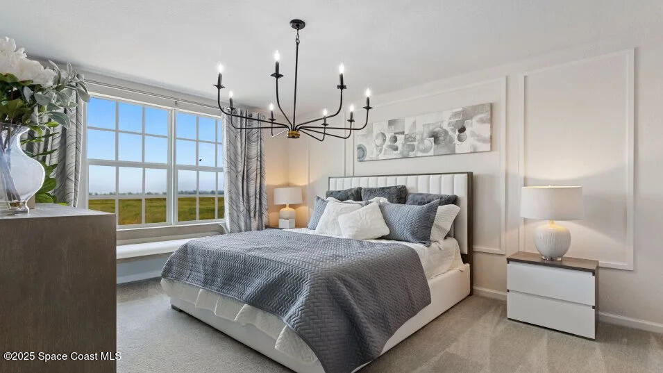 2349 Croft Inlt Drive Northwest Palm Bay, FL 32907 - Photo 6 of 12 a bedroom with a large bed and a window