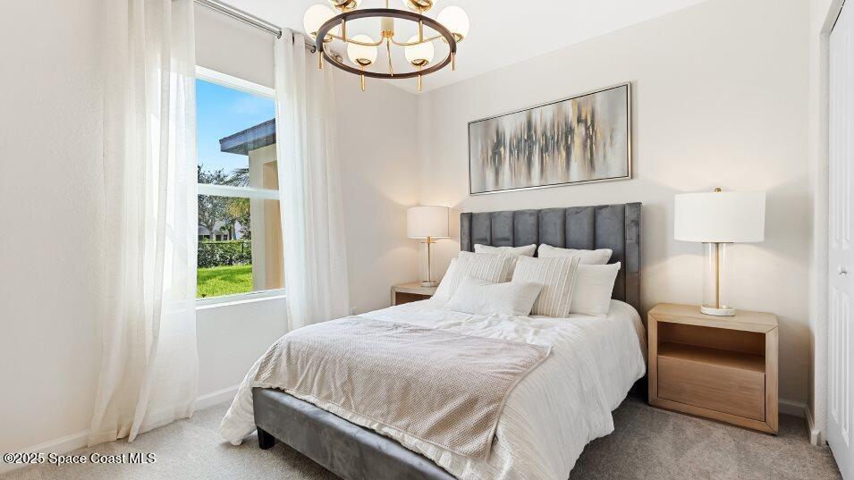 2349 Croft Inlt Drive Northwest Palm Bay, FL 32907 - Photo 7 of 12 a bedroom with a bed and window