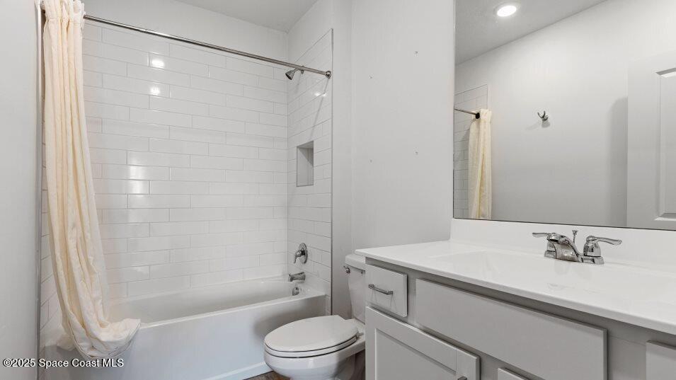 2349 Croft Inlt Drive Northwest Palm Bay, FL 32907 - Photo 8 of 12 a bathroom with a sink a toilet and shower