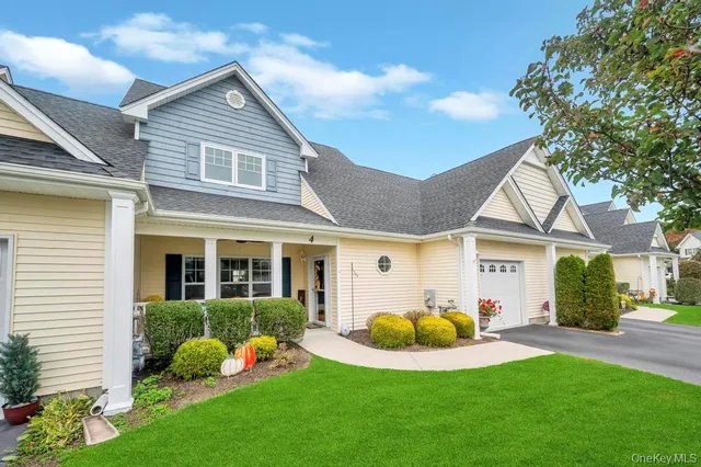 a view of a house with a backyard porch and sitting area