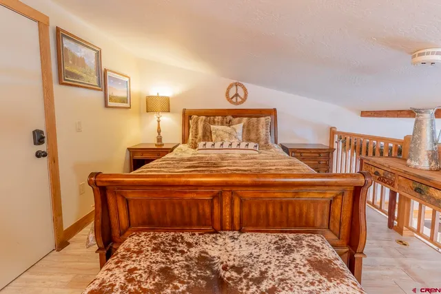 a bedroom with a bed and a table in it