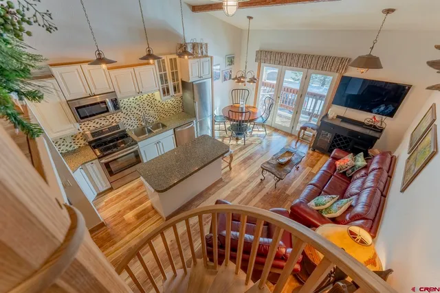 a view of stairs and a living room with furniture