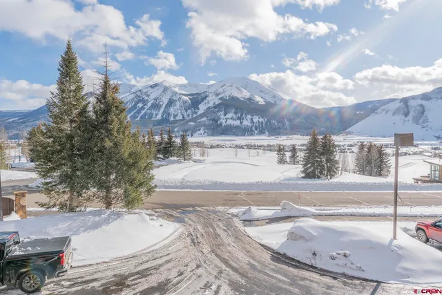 a view of parking area with parked cars