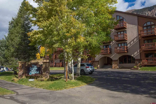 a view of front of house with a yard