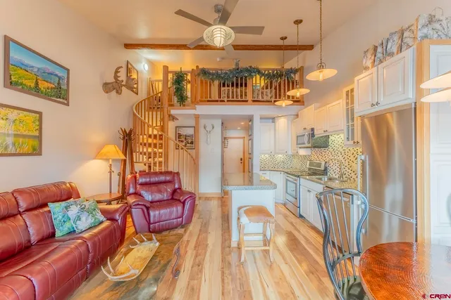 a view of a living room and dining room