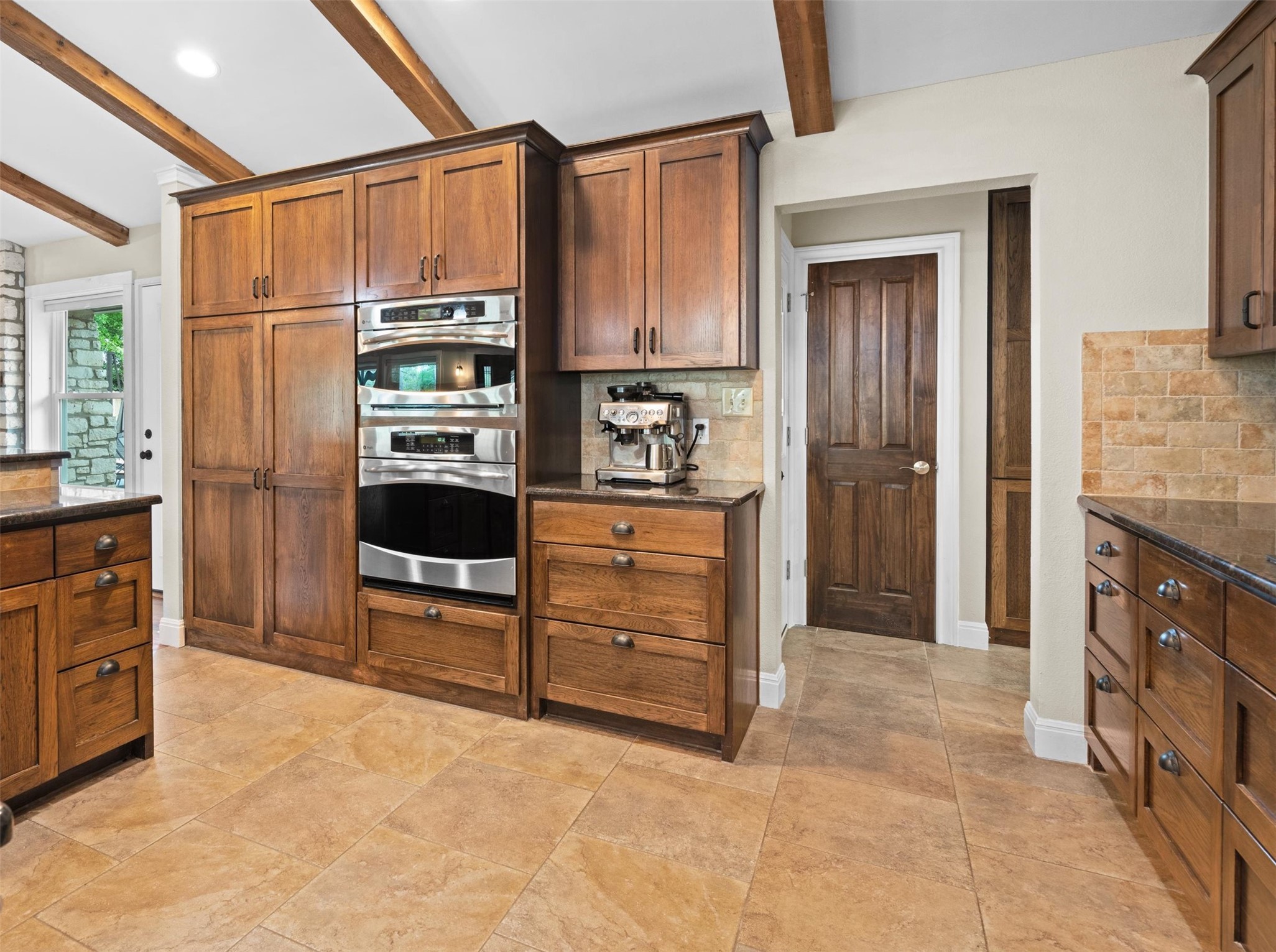 720 Circle G Ranch Road Austin, TX 78737 - Photo 14 of 37 a kitchen with stainless steel appliances a refrigerator and cabinets