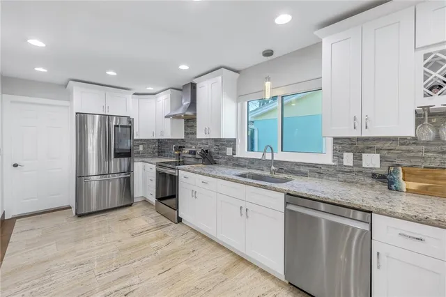 a view of a terrace with couches and potted plants