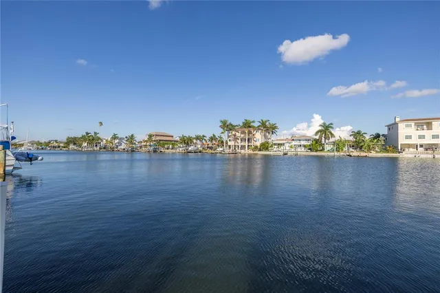 a view of a dining room with furniture and a chandelier