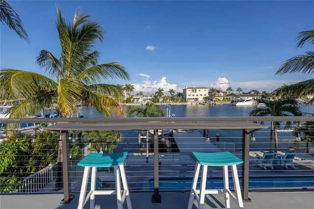 a bathroom with a granite countertop toilet sink and mirror