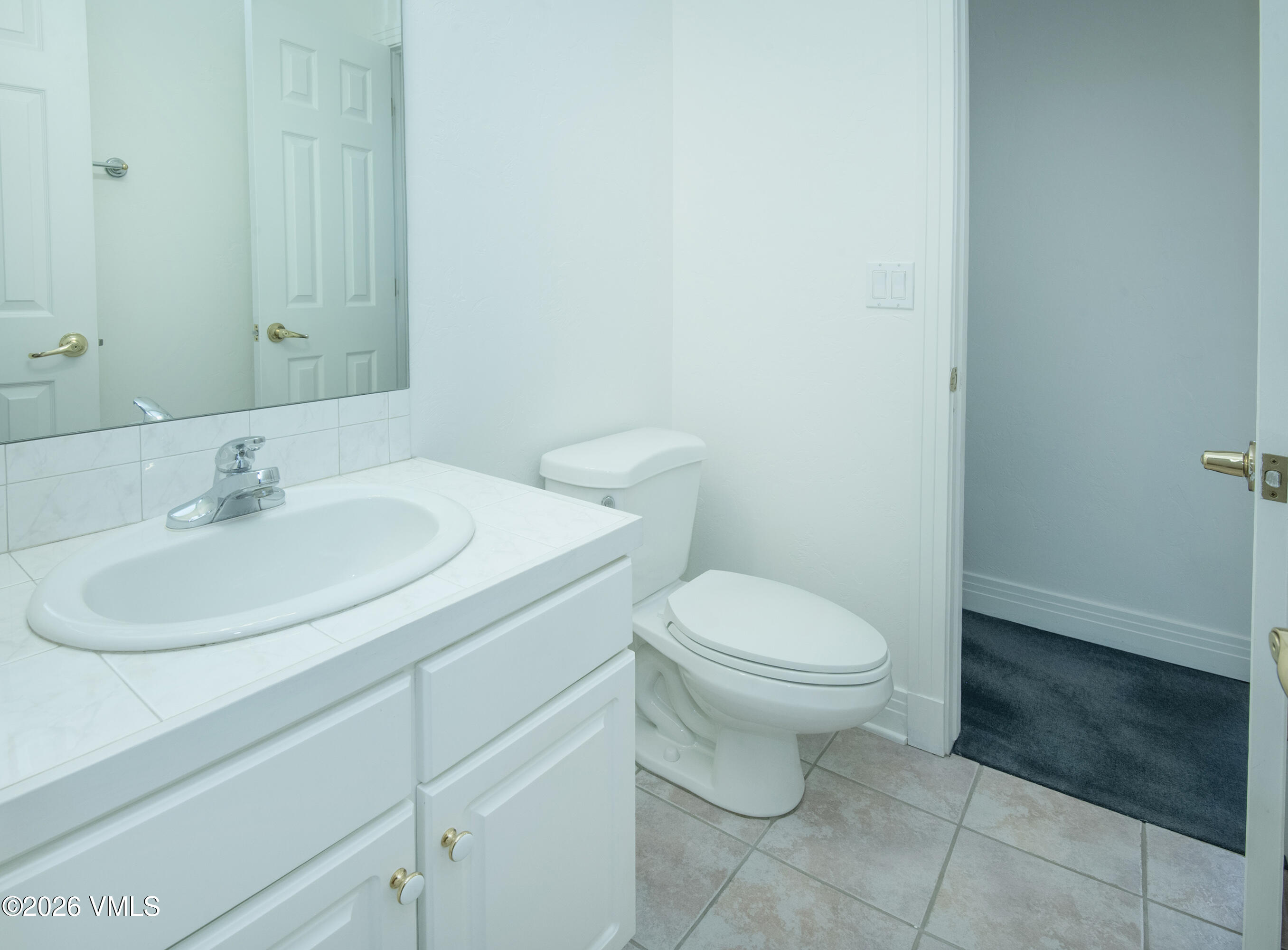 471 Rawhide Road Edwards, CO 81632 - Photo 39 of 51 a bathroom with a sink a toilet and a mirror