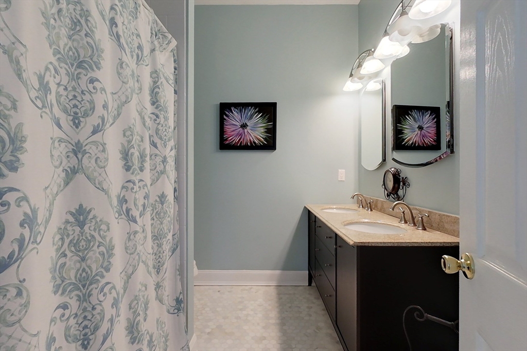 120 1/2 Lowell Road, Unit A Pepperell, MA 01463 - Photo 14 of 30 a bathroom with a sink and a mirror
