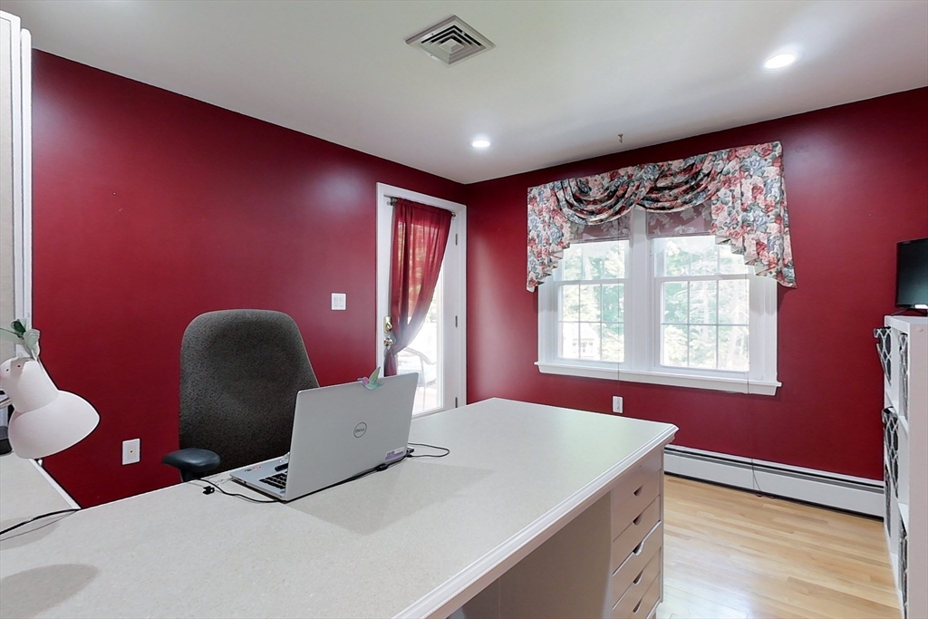 120 1/2 Lowell Road, Unit A Pepperell, MA 01463 - Photo 17 of 30 a living room with furniture and a large window