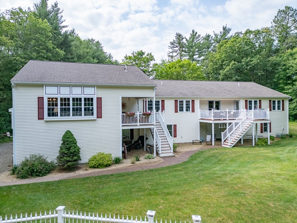 120 1/2 Lowell Road, Unit A Pepperell, MA 01463 - Photo 21 of 30 a house view with a garden space