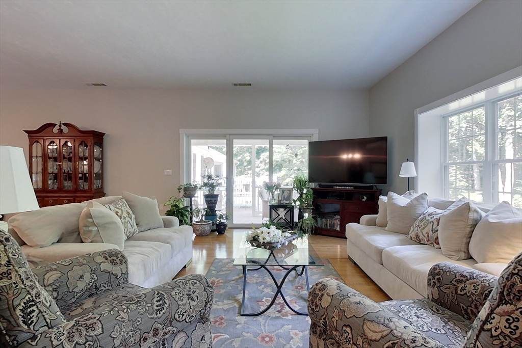 120 1/2 Lowell Road, Unit A Pepperell, MA 01463 - Photo 10 of 30 a living room with furniture and a flat screen tv