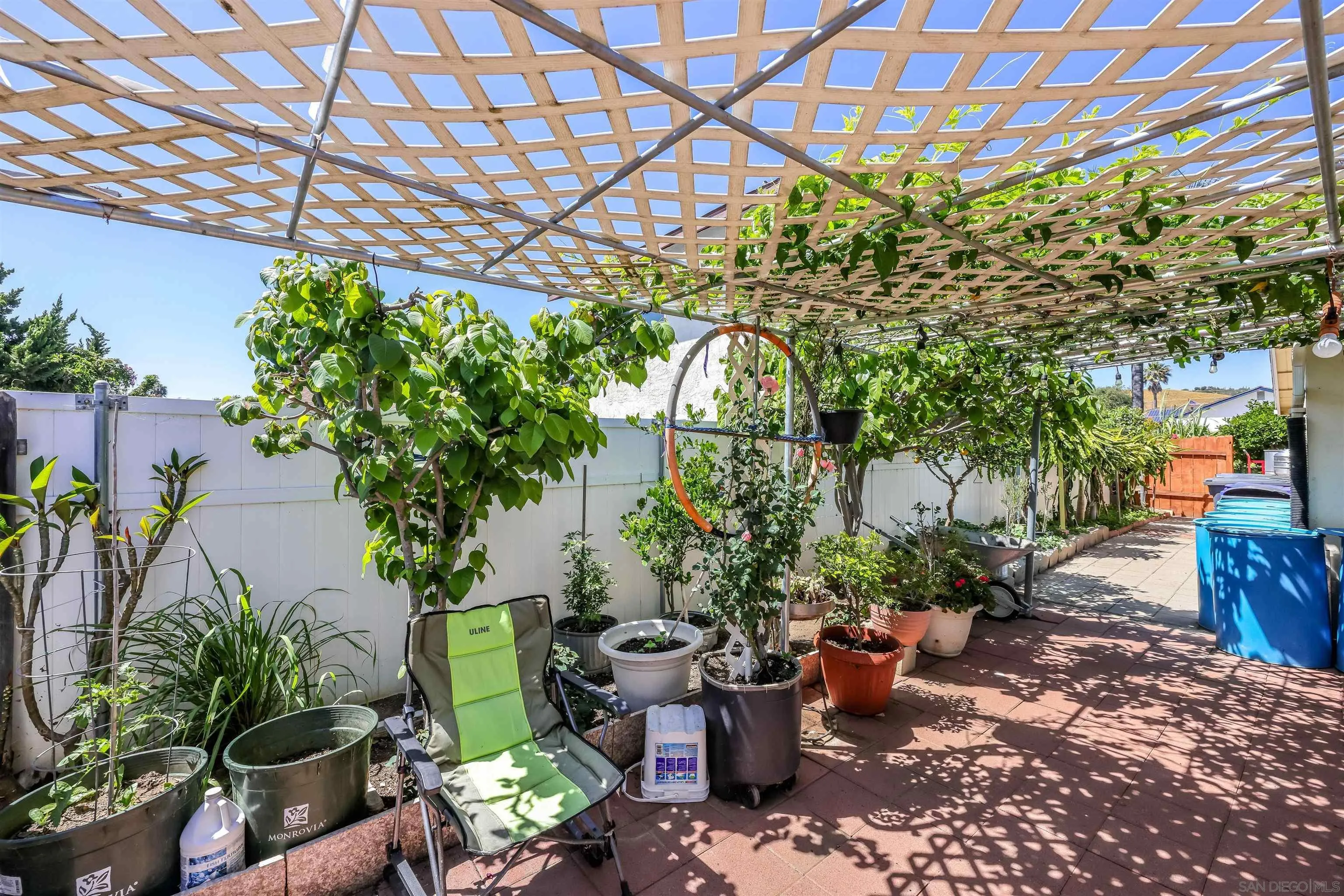 14513 Mirando Street Poway, CA 92064 - Photo 15 of 25 a view of a backyard with plants and a patio