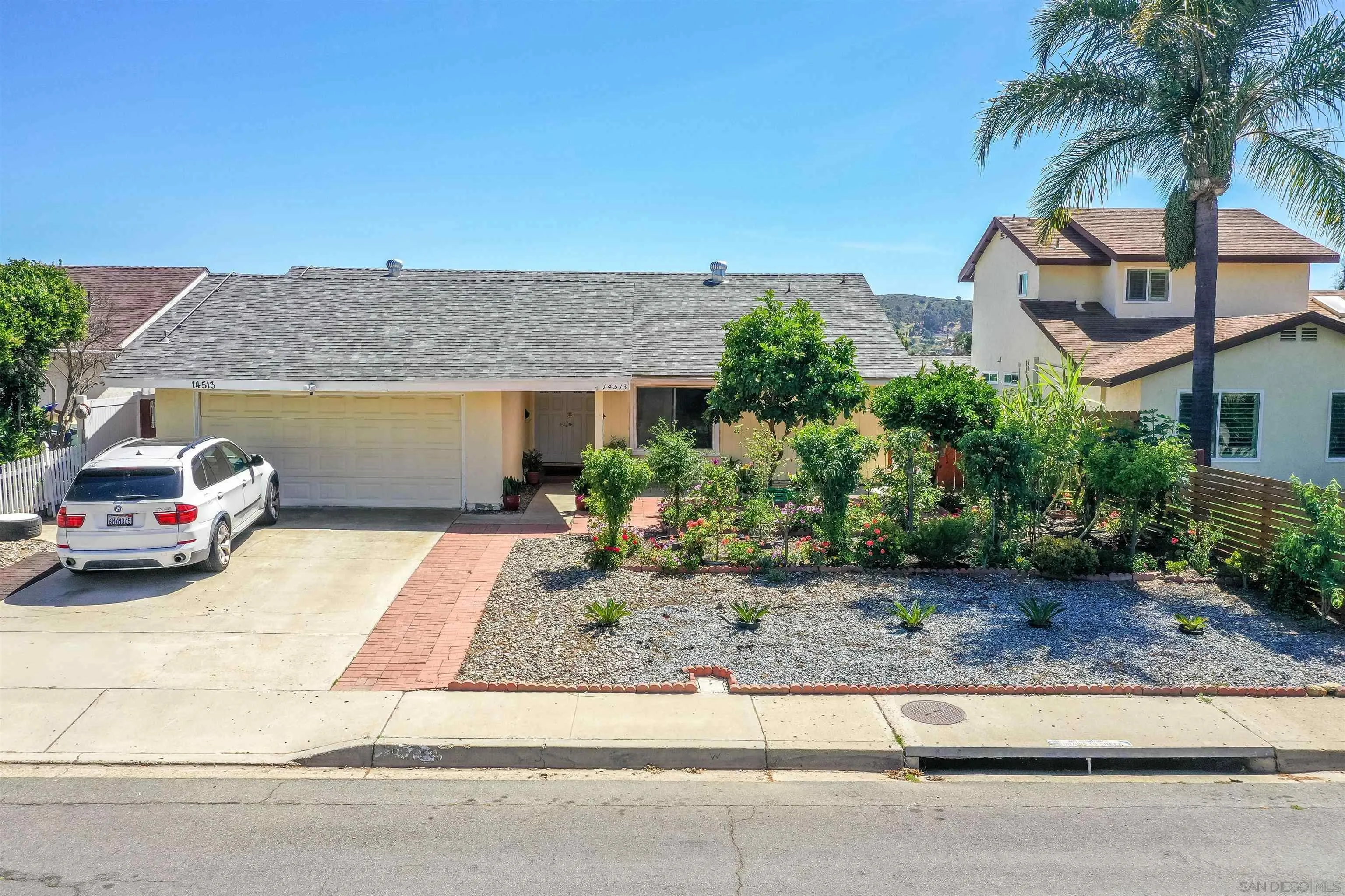 14513 Mirando Street Poway, CA 92064 - Photo 17 of 25 a house view with a garden space