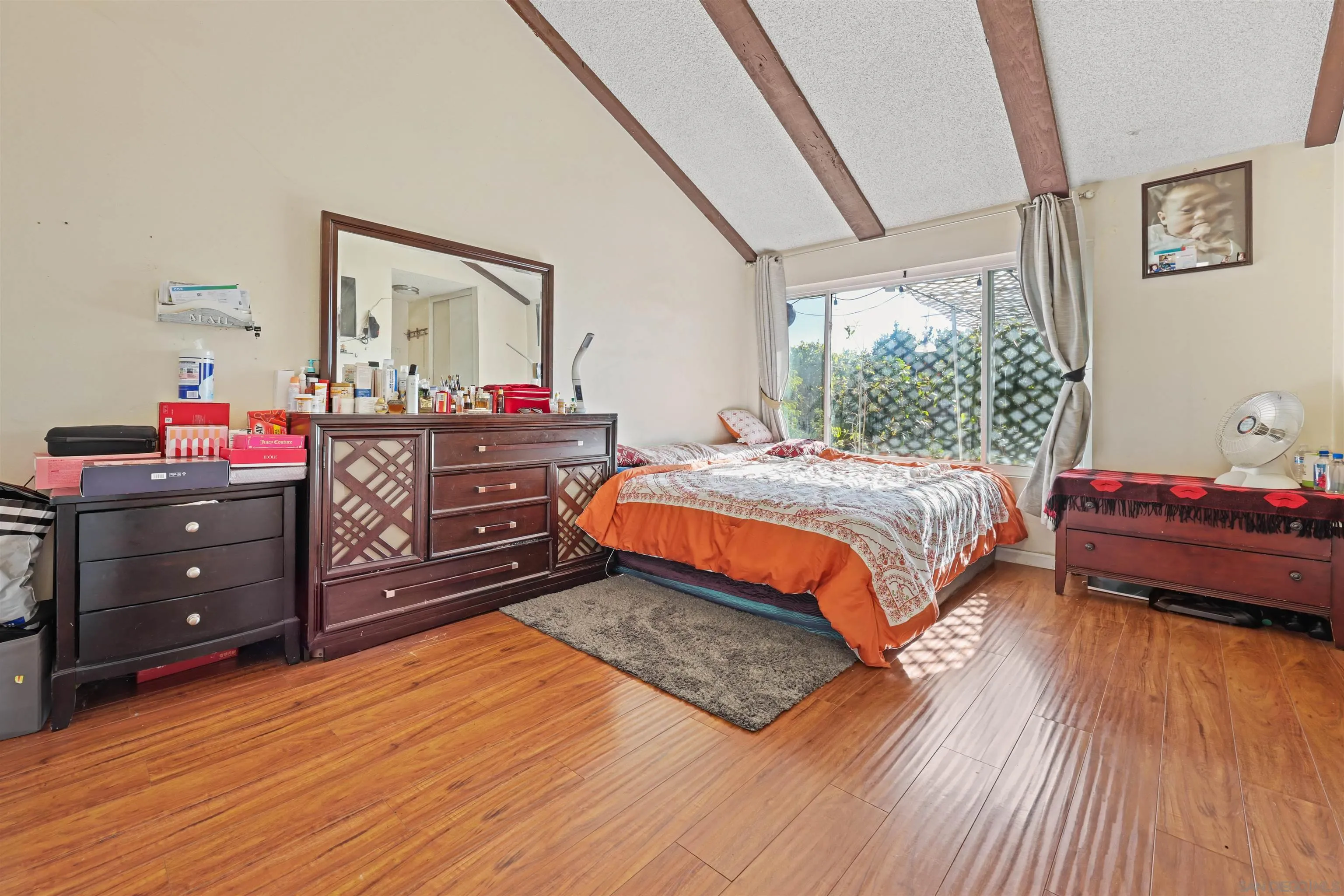 14513 Mirando Street Poway, CA 92064 - Photo 6 of 25 a bedroom with a bed and wooden floor