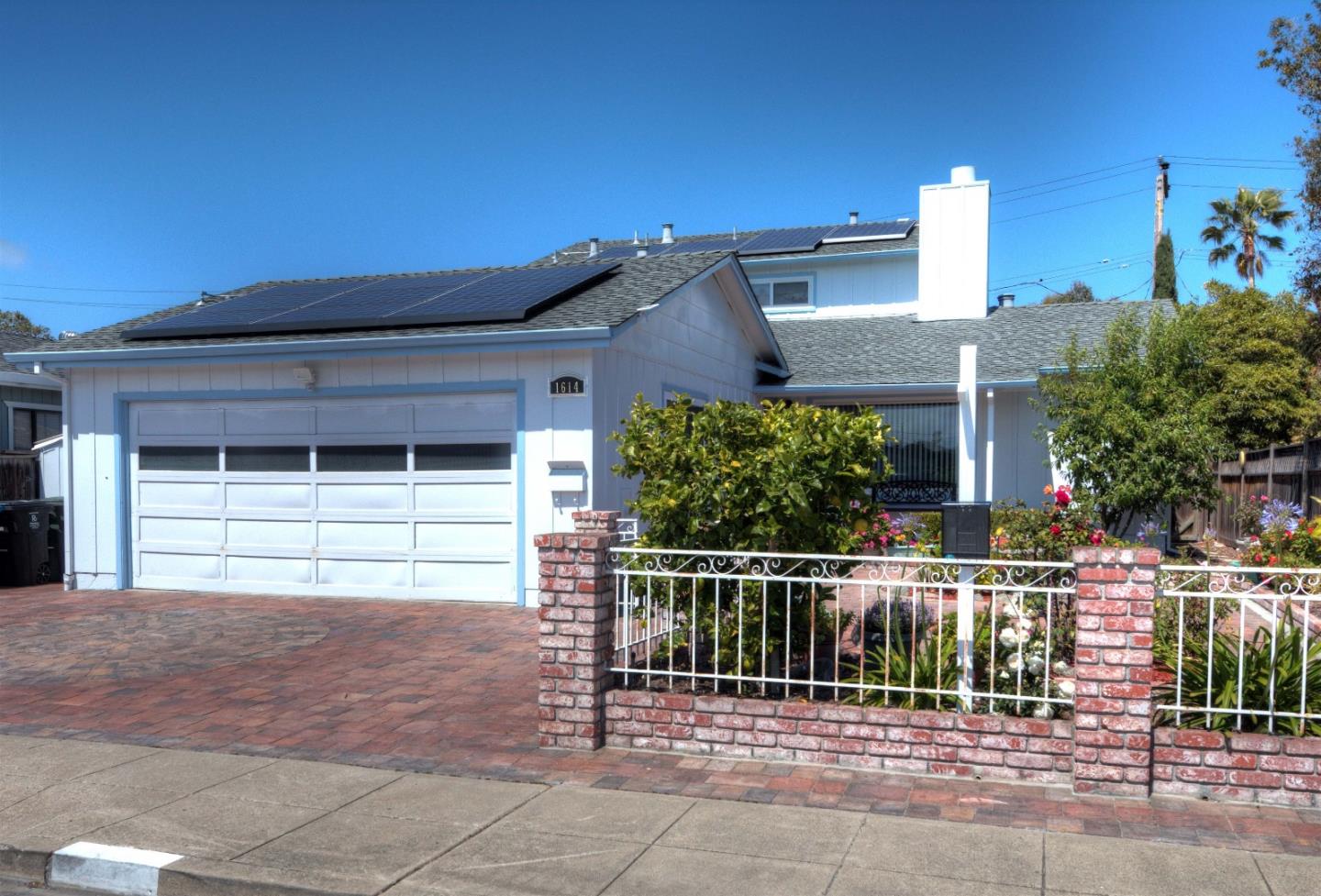 front view of a house with a small yard