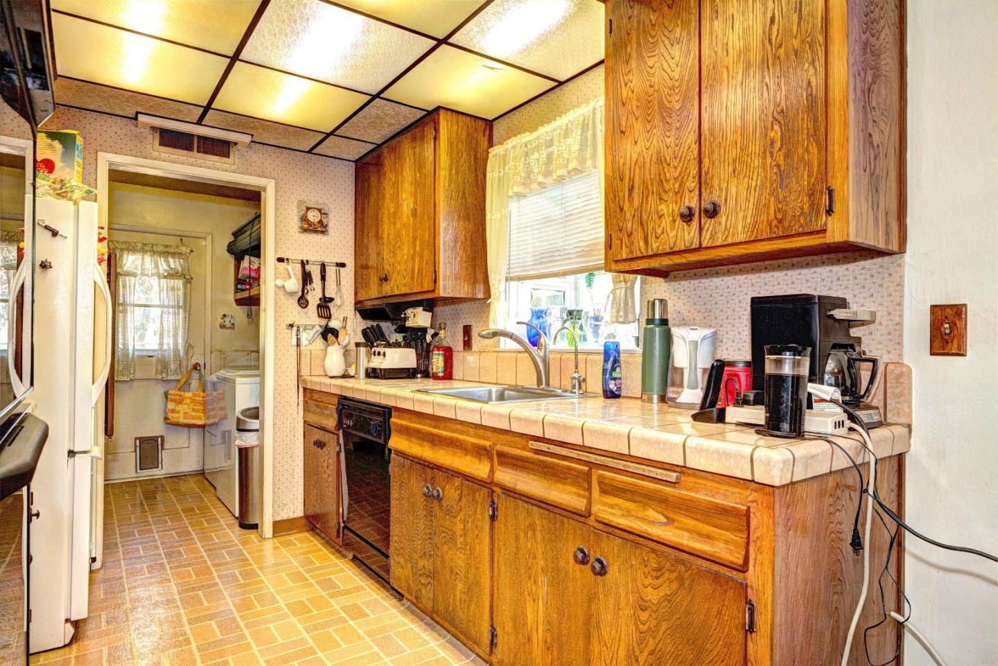 1614 Roberta Drive San Mateo, CA 94403 - Photo 4 of 6 a view of a kitchen with a sink and cabinets
