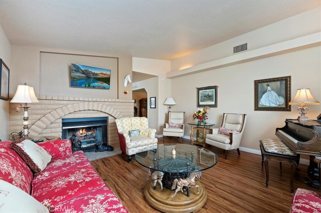 1168 North Crescent Ridge Road Fallbrook, CA 92028 - Photo 11 of 45 a living room with furniture and a fireplace