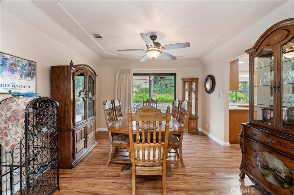 1168 North Crescent Ridge Road Fallbrook, CA 92028 - Photo 12 of 45 a view of a dining room with furniture window and wooden floor