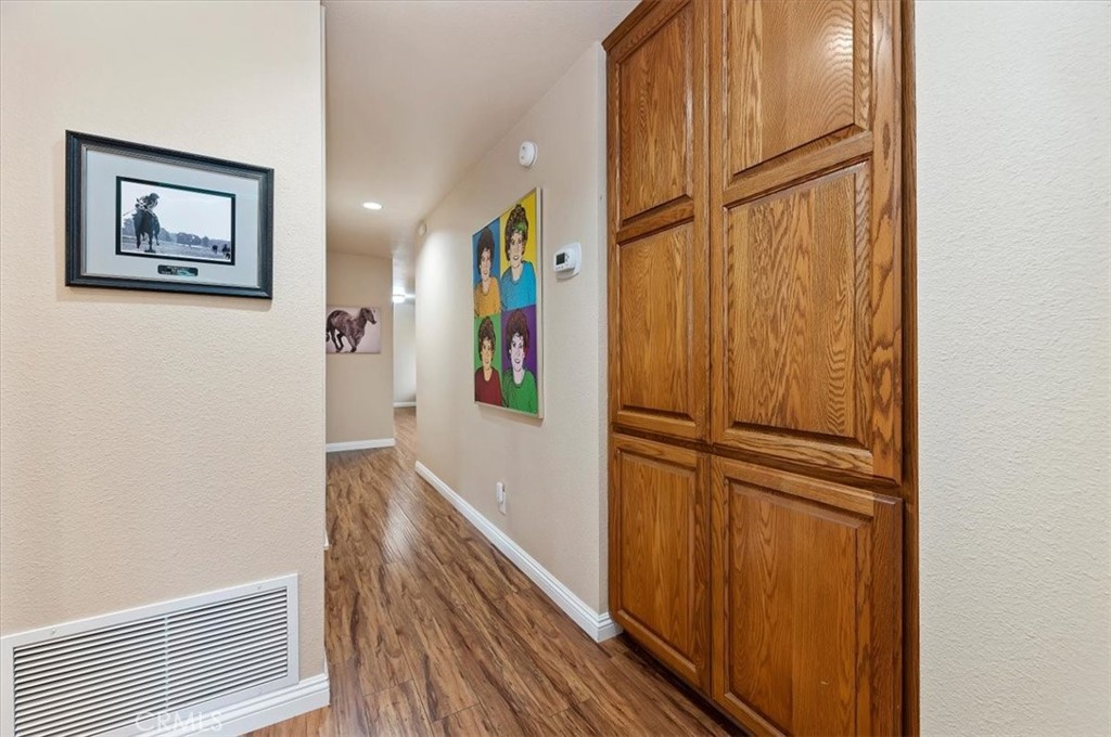 1168 North Crescent Ridge Road Fallbrook, CA 92028 - Photo 22 of 45 a view of a hallway with wooden floor and entryway