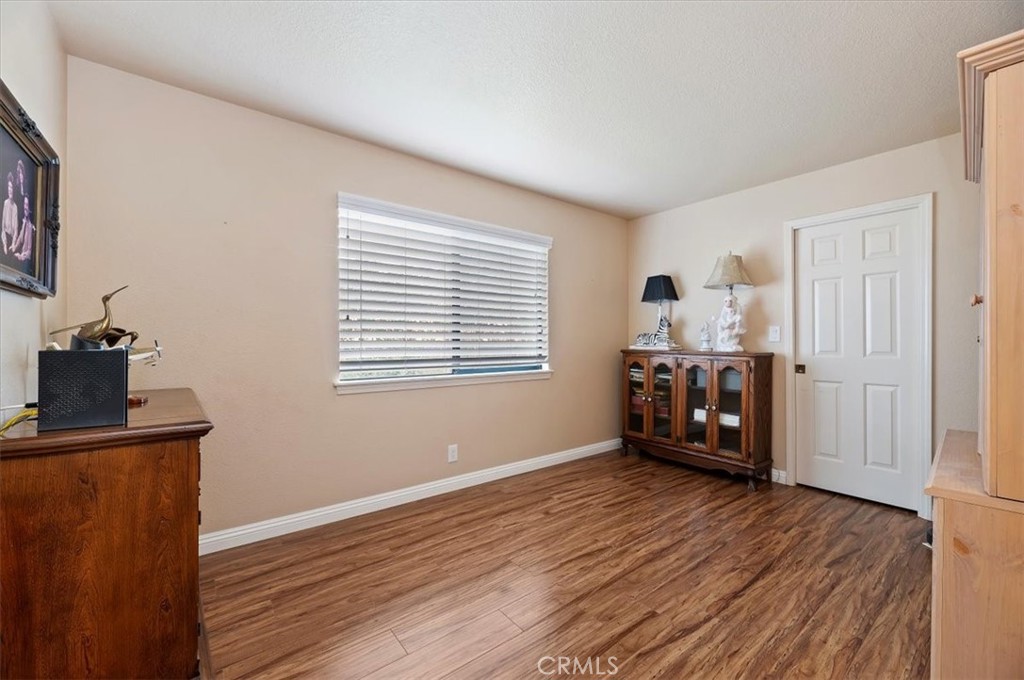 1168 North Crescent Ridge Road Fallbrook, CA 92028 - Photo 23 of 45 a room with furniture and wooden floor