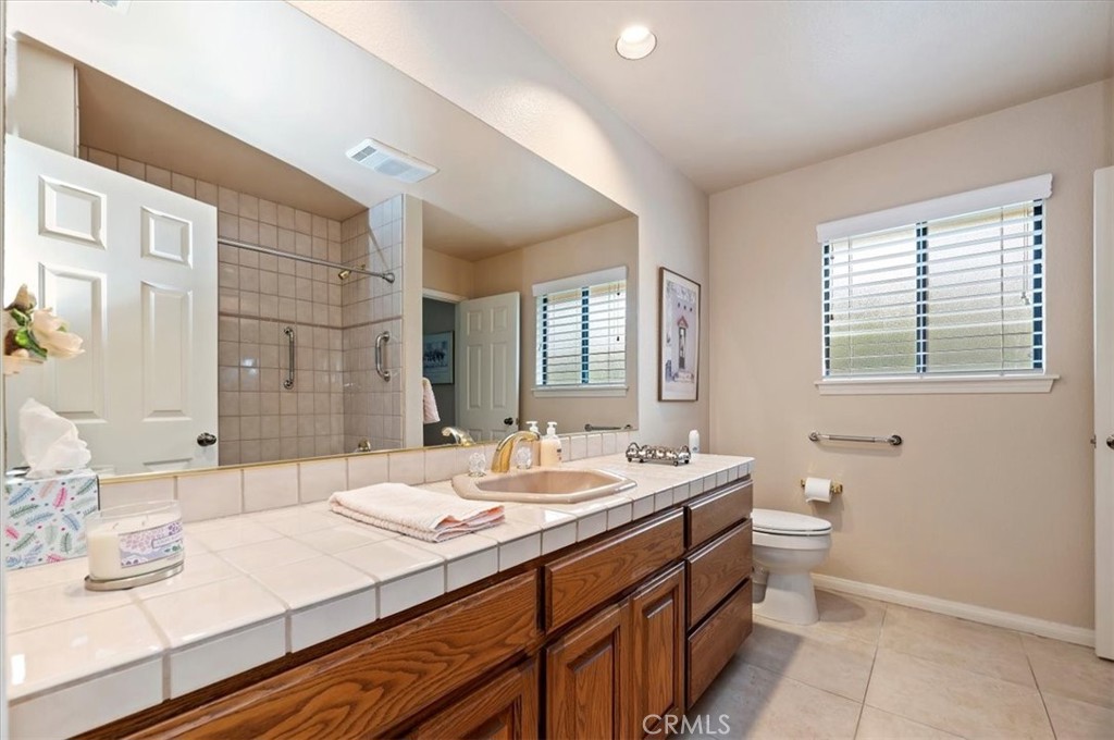 1168 North Crescent Ridge Road Fallbrook, CA 92028 - Photo 25 of 45 a bathroom with a sink double vanity granite and a mirror