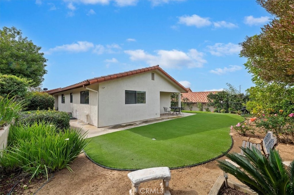 1168 North Crescent Ridge Road Fallbrook, CA 92028 - Photo 33 of 45 a view of a backyard with plants and a garden
