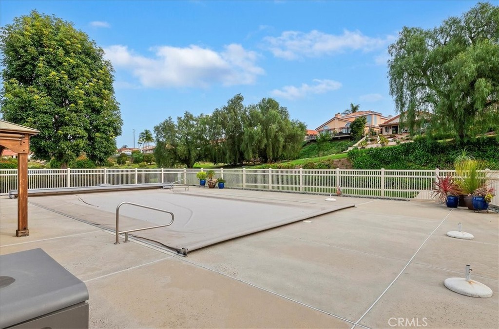 1168 North Crescent Ridge Road Fallbrook, CA 92028 - Photo 38 of 45 a view of a tennis ground with large trees