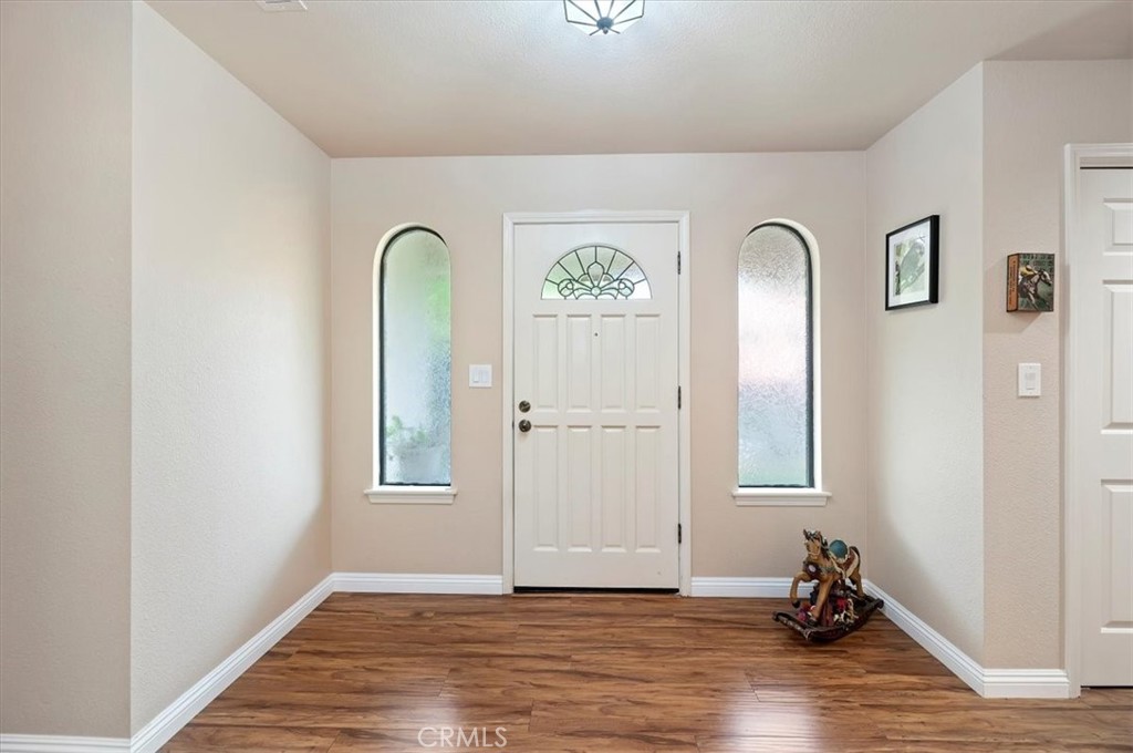 1168 North Crescent Ridge Road Fallbrook, CA 92028 - Photo 7 of 45 a view of a livingroom with wooden floor and a window