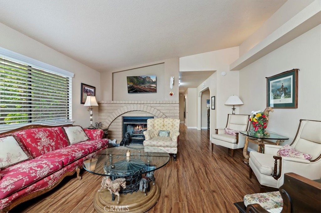 1168 North Crescent Ridge Road Fallbrook, CA 92028 - Photo 10 of 45 a living room with furniture and a fireplace