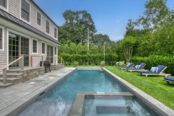 a view of a backyard with a garden and plants