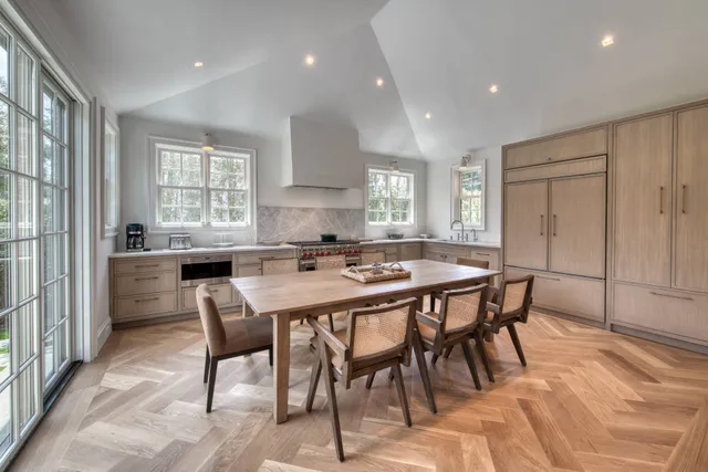 a kitchen with a table and chairs in it