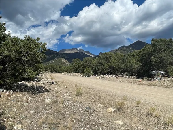 a view of a yard with snow on the road