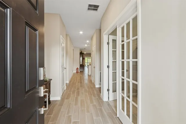 a kitchen with a sink dining table and chairs