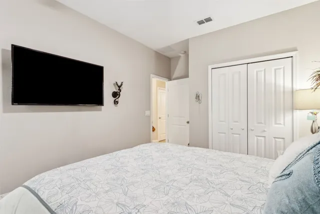 a kitchen with a table chairs and wooden floor